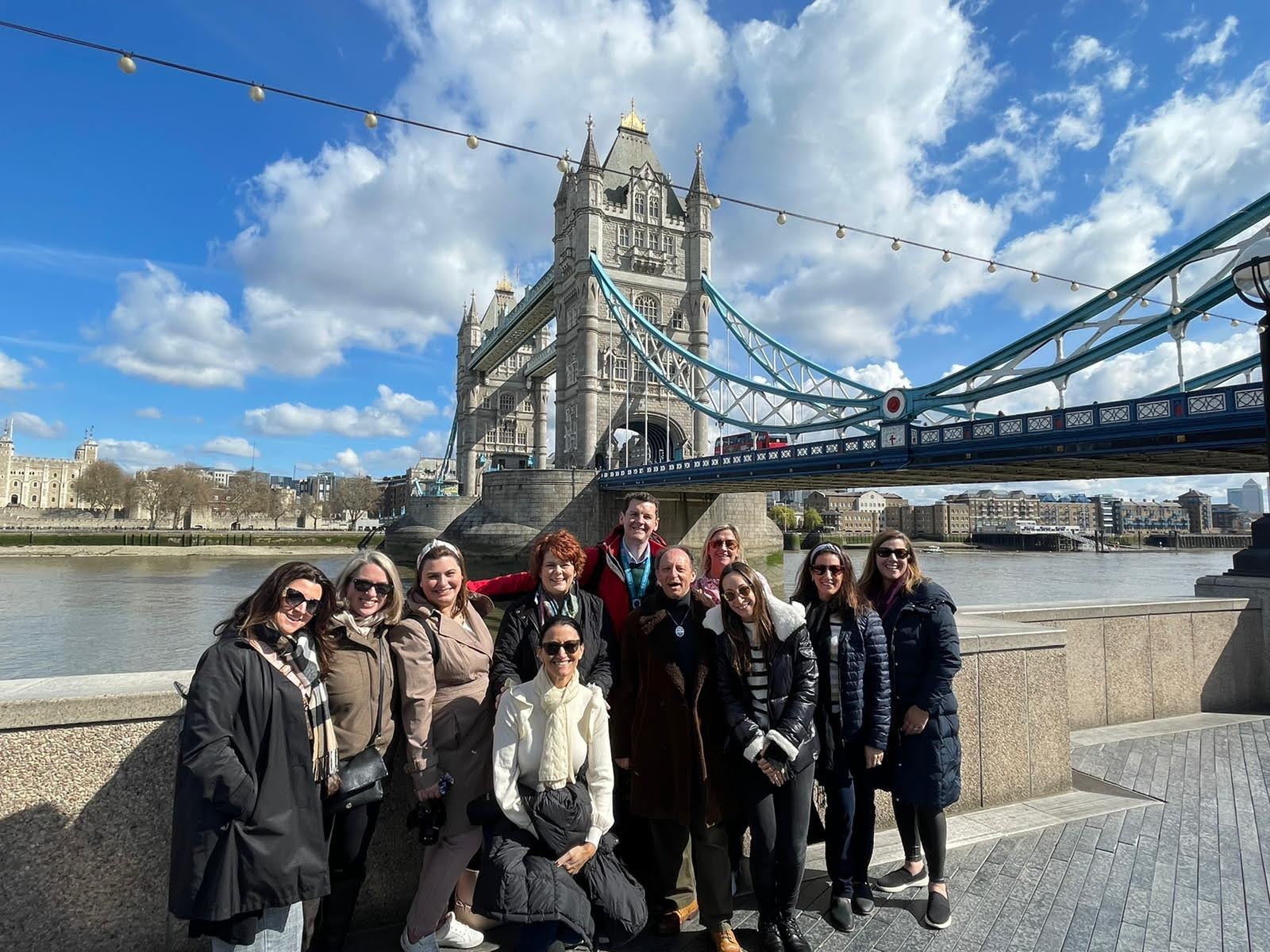 Travel group together at Tower Bridge in London
