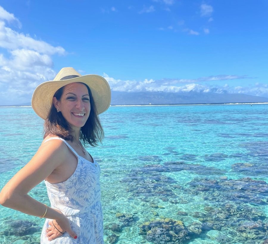 Lisa Rubin Reich by clear blue ocean