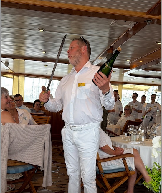 Celebratory champagne moment aboard a group cruise